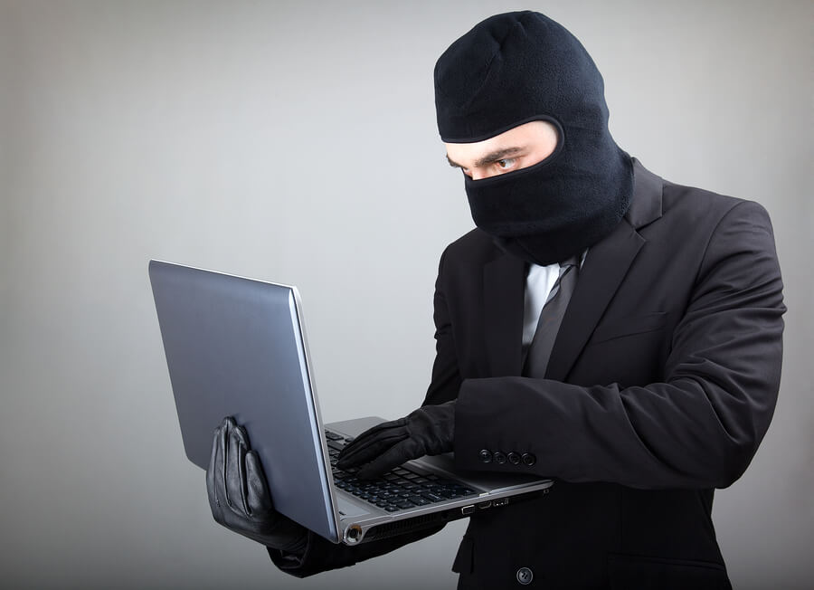 Hacker meme hacking with a laptop